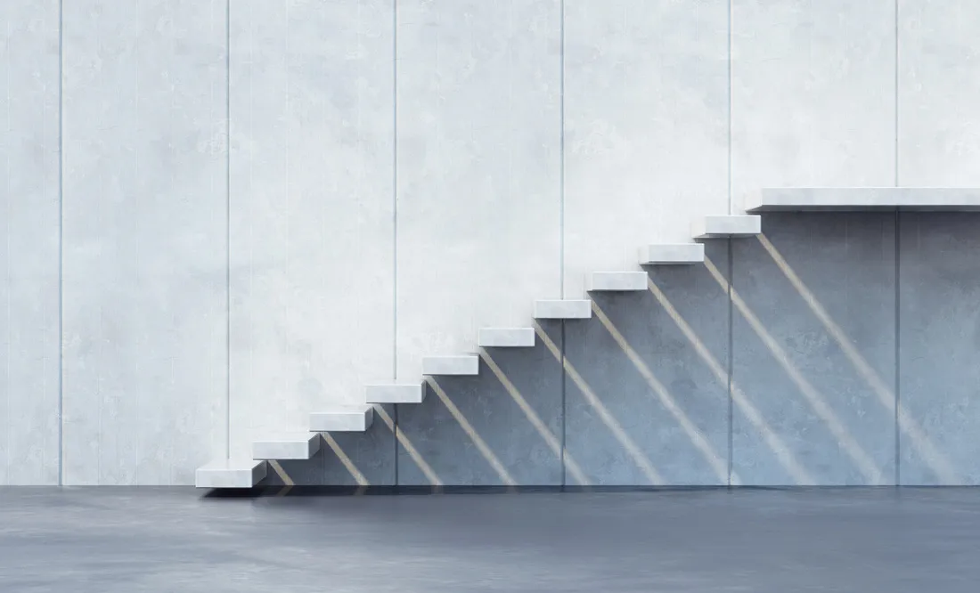 Conceptual floating staircase representing step-by-step progress